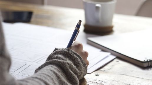 Girl writing content at a desk