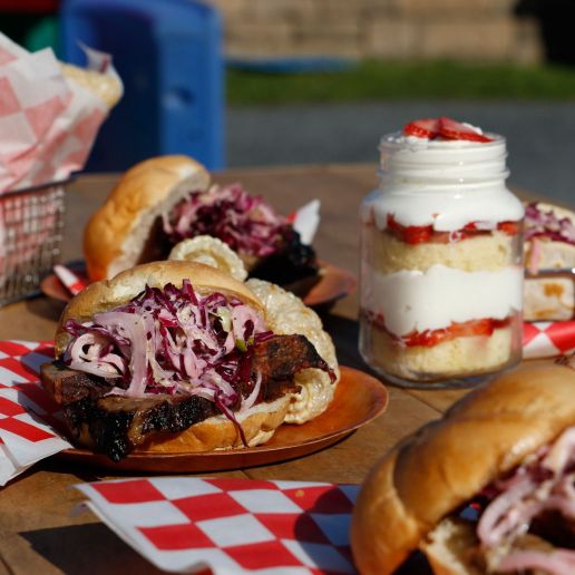 Sandwiches and desserts on wood table