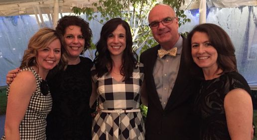 People in a group shot dressed in gingham