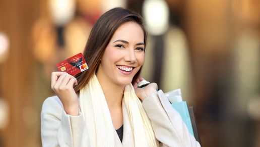 Woman holding an Ephrata National Bank debit card