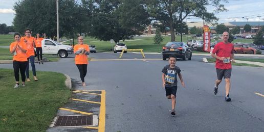 Scott Scheffey running with his grandson