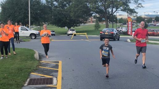 Scott Scheffey running with his grandson