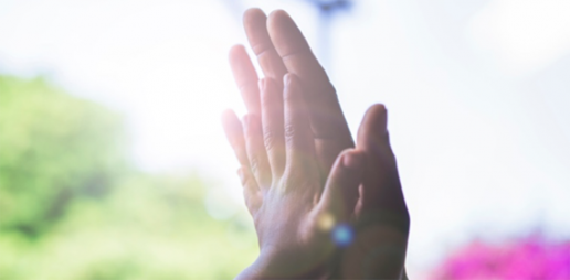 Small child's hand on an adult's hand