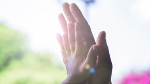 Small child's hand on an adult's hand