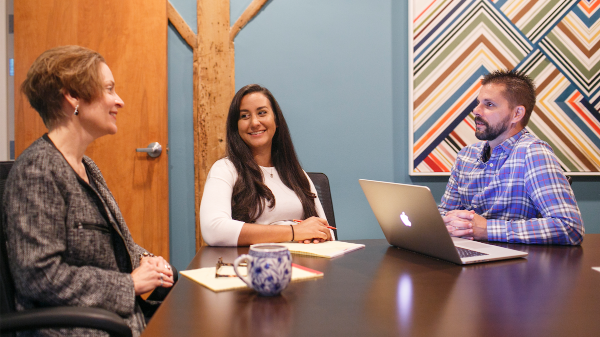 Marketers sitting at a conference table