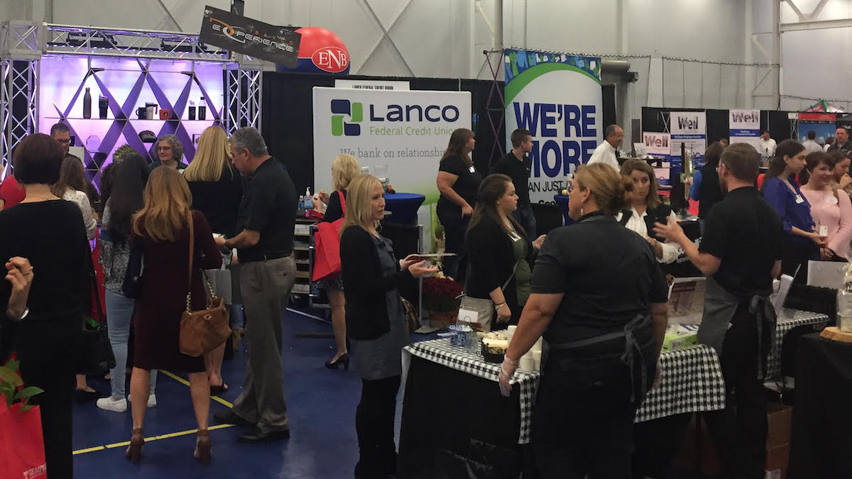 People walking among trade show booths